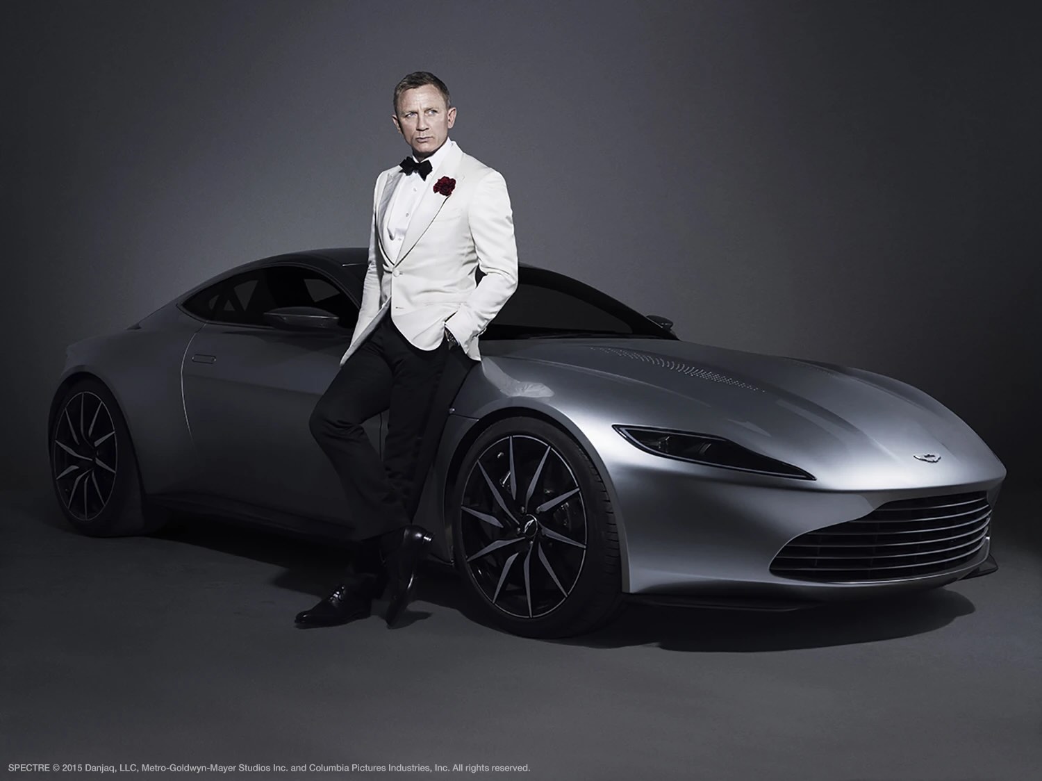 James Bond holding a trophy